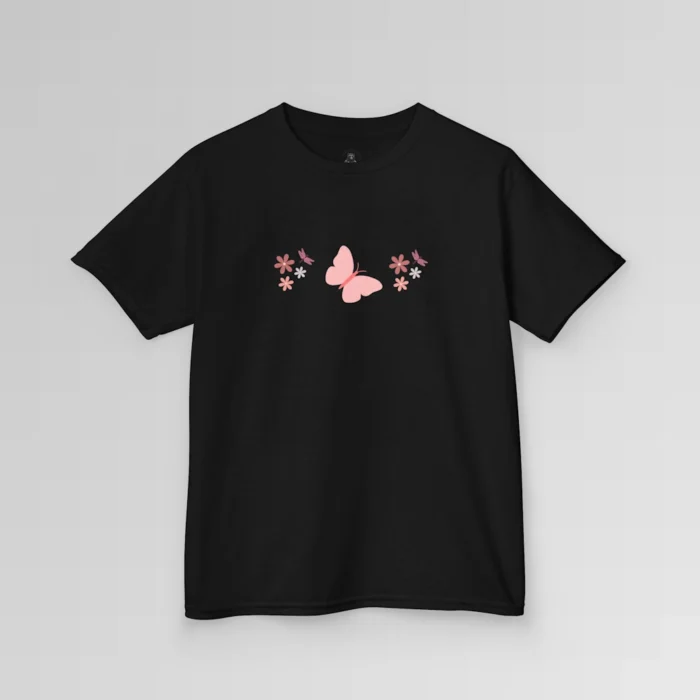 A black colored shirt with a pink butterfly with a coral-colored body in the center, and pink, white, and blush colored flowers, and blush colored dragonflies...in a pattern going vertically across the tee. Child's Version.