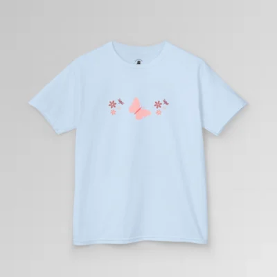 A light blue colored shirt with a pink butterfly with a coral-colored body in the center, and pink, white, and blush colored flowers, and blush colored dragonflies...in a pattern going vertically across the tee. Child's Version.