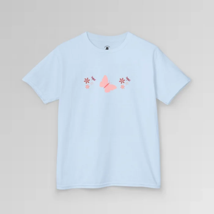 A light blue colored shirt with a pink butterfly with a coral-colored body in the center, and pink, white, and blush colored flowers, and blush colored dragonflies...in a pattern going vertically across the tee. Child's Version.