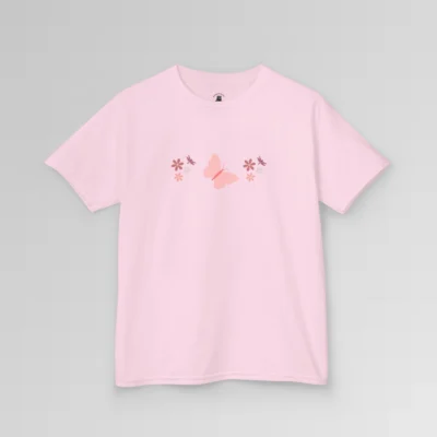 A pink colored shirt with a pink butterfly with a coral-colored body in the center, and pink, white, and blush colored flowers, and blush colored dragonflies...in a pattern going vertically across the tee. Child's Version.
