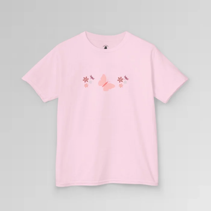 A pink colored shirt with a pink butterfly with a coral-colored body in the center, and pink, white, and blush colored flowers, and blush colored dragonflies...in a pattern going vertically across the tee. Child's Version.