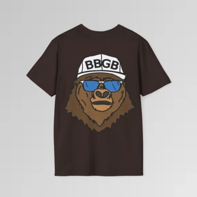 The back of a dark chocolate colored shirt, with the Big Baby Gorilla Bear Mascot's face, wearing a white ball cap, and blue and white shades, super imposed on the back of a tee shirt.