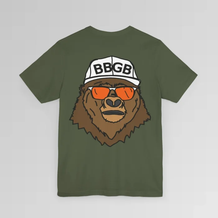 The back of a military green colored shirt, with the Big Baby Gorilla Bear Mascot's face, wearing a white ball cap, and orange and white shades, super imposed on the back of a tee shirt.