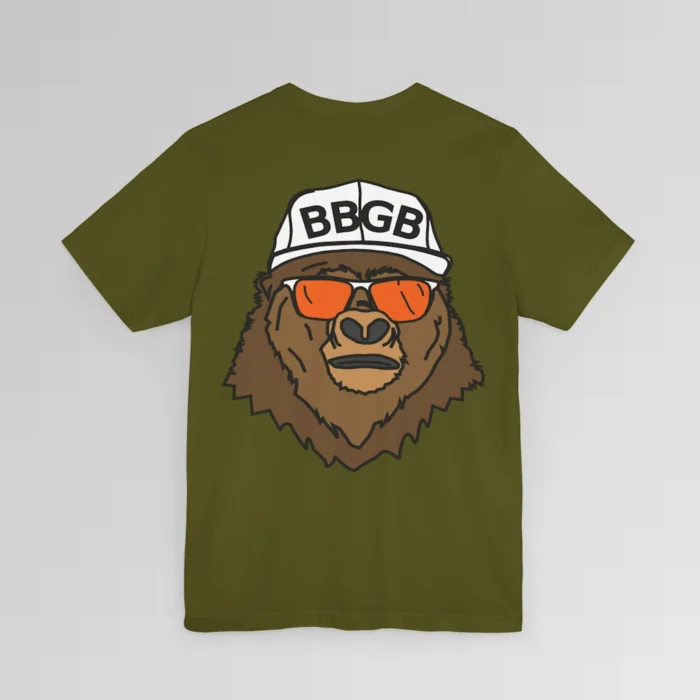 The back of a olive colored shirt, with the Big Baby Gorilla Bear Mascot's face, wearing a white ball cap, and orange and white shades, super imposed on the back of a tee shirt.