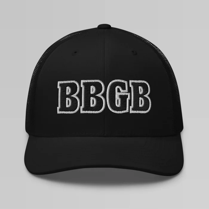 A black hat with the letters "BBGB" embroidered on the front in black thread, with a white border, on a trucker cap with a mesh back.