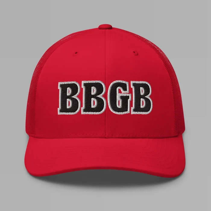 A red hat with the letters "BBGB" embroidered on the front in black thread, with a white border, on a trucker cap with a mesh back.