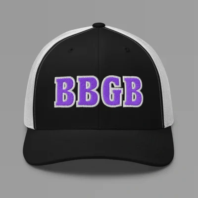 A black and white hat with the letters "BBGB" embroidered on the front in purple thread, with a white border, on a trucker cap with a mesh back.