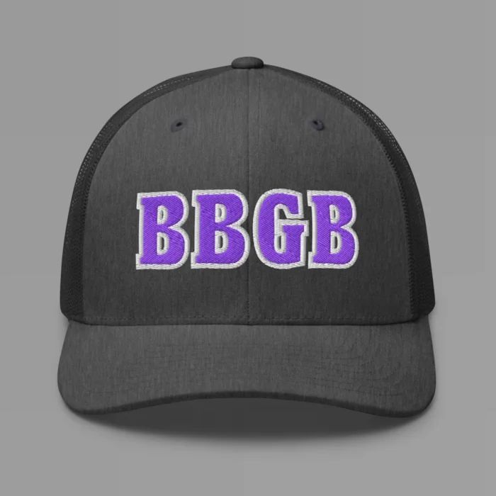 A dark heather grey hat with the letters "BBGB" embroidered on the front in purple thread, with a white border, on a trucker cap with a mesh back.