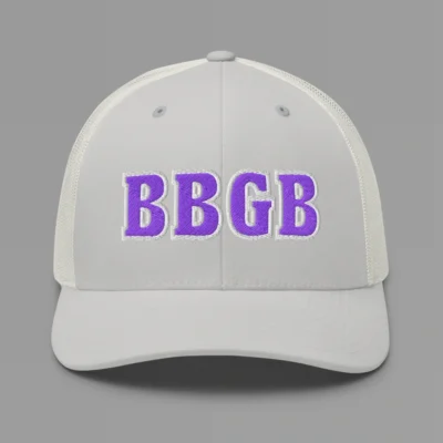 A silver hat with the letters "BBGB" embroidered on the front in purple thread, with a white border, on a trucker cap with a mesh back.