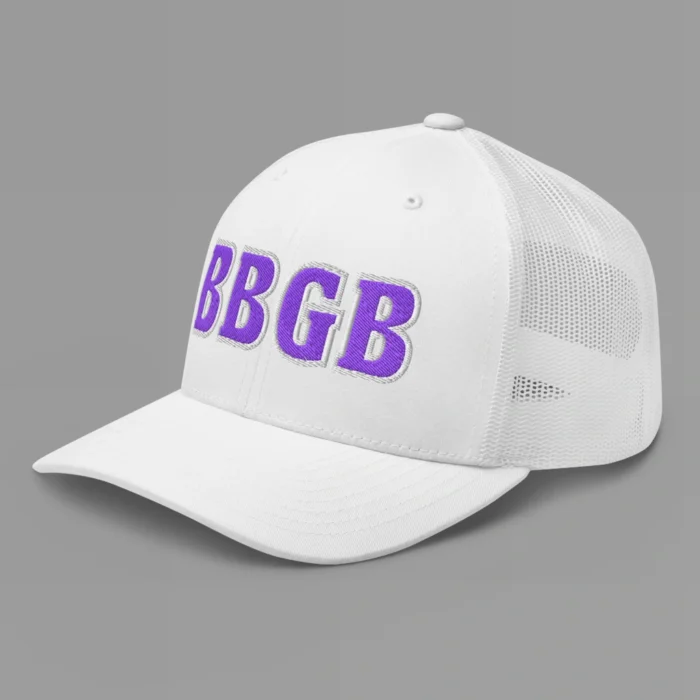 A white hat with the letters "BBGB" embroidered on the front in purple thread, with a white border, on a trucker cap with a mesh back. (Left Side View)