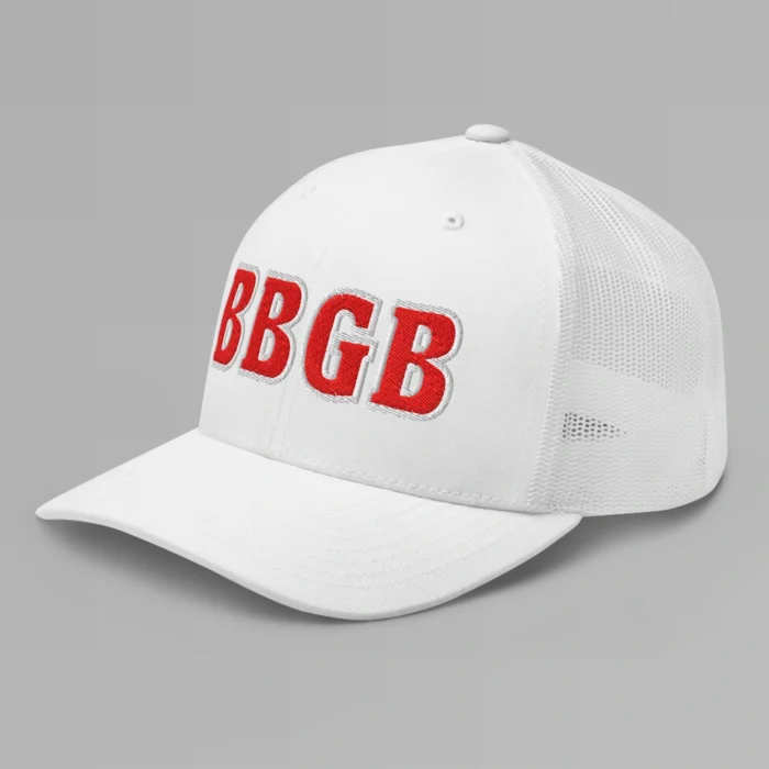 A white hat with the letters "BBGB" embroidered on the front in red thread, with a white border, on a trucker cap with a mesh back. (Left Side View)