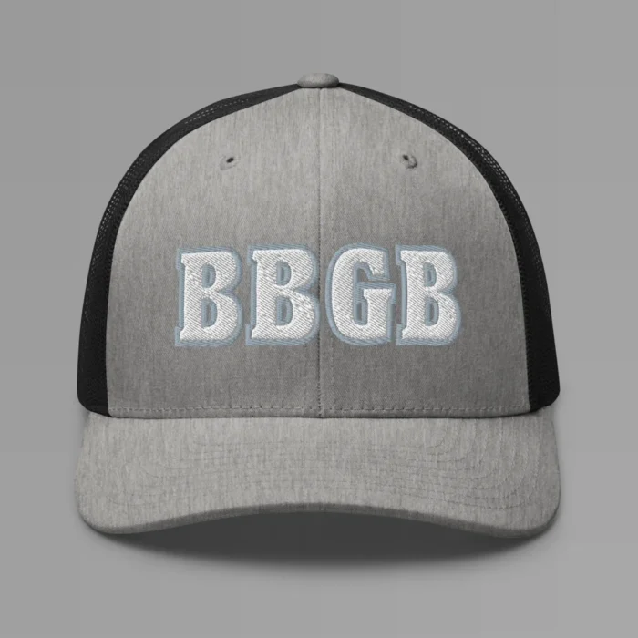 A heather and black hat with the letters "BBGB" embroidered on the front in white thread, with a silver border, on a trucker cap with a mesh back.