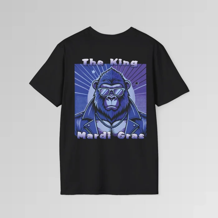 The backside of a black tee with a swag looking gorilla bear wearing shades, with a sun like object with rays shooting out from behind the character. The words "The King" are above the graphic, and "Mardi Gras" beneath the graphic. The entire image is in varying shades of purple.