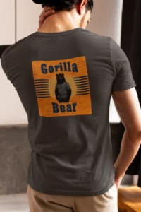 Male model showcasing the back of the Gorilla Bear Sunset Graphic Tee - brown.