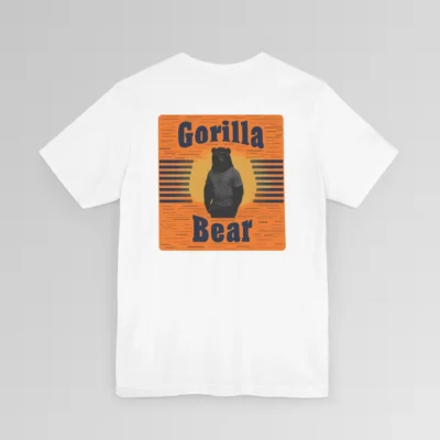 An orange and dark navy colored rectangular design on the back of a Big Baby Gorilla Bear Tee. Our Gorilla Bear Mascot Silhouette is in front of an orange and yellow sunset, with vertical blue lines on each side. The words "Gorilla" are at the top of the design, and "Bear" is at the bottom of the design. Shirt color - white.