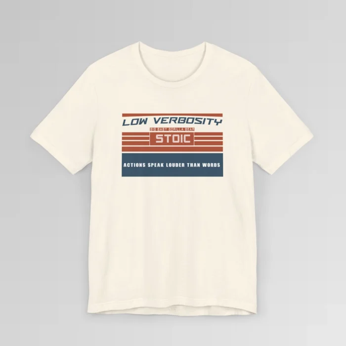 An orange and blue rectangular graphic, block styled", with the words "Low Verbosity", "Big Baby Gorilla Bear", "Stoic", and "Actions Speak Louder Than Words" on the front of the t-shirt. Color; Natural.