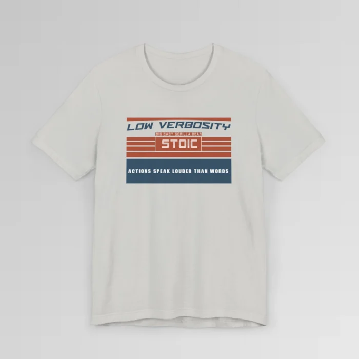 An orange and blue rectangular graphic, block styled", with the words "Low Verbosity", "Big Baby Gorilla Bear", "Stoic", and "Actions Speak Louder Than Words" on the front of the t-shirt. Color; Silver.