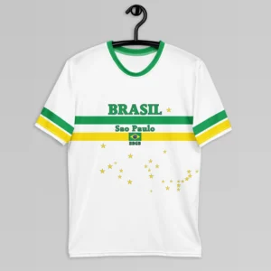 The frontside of the Sao Paulo Brasil Luxurious Tee, with a green collar, green and yellow sleeve stripes, and green and yellow bands on the front.. The words "Brasil" and "Sao Paulo" are above and below the green band. The Brazilian Flag is in the center of the yellow band. "BBGB" is beneath the flag. Stars are scattered on the shirt in the pattern similar to the Brazilian flag. The shirt is on a hanger.