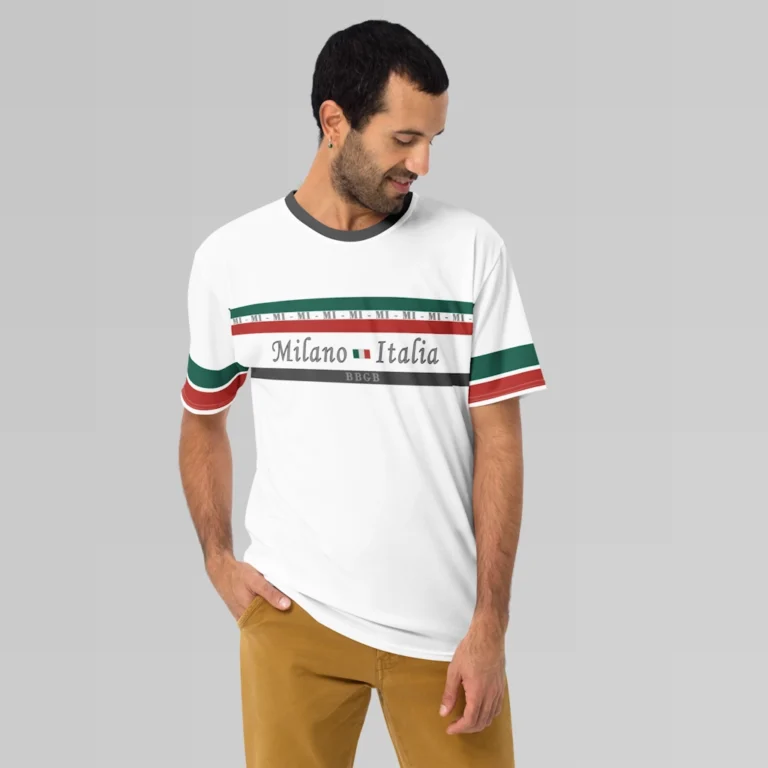 Male model looking left and downward, wearing a white, Milano Italia Luxurious Tee from BigBabyGorillaBear.Com. The shirt has green and red stripes, the letters "MI", and the words Milano and Italia centered around the Italian flag, with striped sleeves (red and green). There is a dark grey stripe with "BBGB" in the center on the bottom of the chest area.