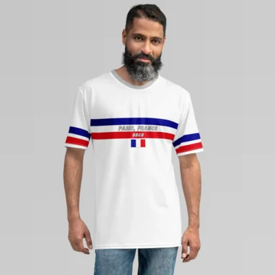 A male model showcasing the white Paris France Luxurious Tee from BigBabyGorillaBear.Com. The shirt has he words "Paris, France" in grey font, between a blue and red band going across the chest of the shirt. A white "BBGB" is centered inside the red band, and beneath that is the France flag. The sleeves have a red and blue stripe. The collar is light grey.