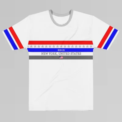 The New York United States Luxurious Tee from BigBabyGorillaBear.Com, white tee. The shirt has three bands across the chest (red, blue, and dark grey). Light grey stars span across and in between the red and blue bands. a white "BBGB" is centered inside the blue band. Light grey "New York, United States" is centered between the blue and dark grey bands. in the center of the dark grey band is a small American flag, centered. The sleeves have red and blue stripes, with a black outline.