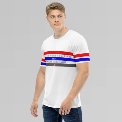 Male model looking straight-left, angled to the right, wearing the New York United States Luxurious Tee from BigBabyGorillaBear.Com, on a hanger. The shirt has three bands across the chest (red, blue, and dark grey). Light grey stars span across and in between the red and blue bands. a white "BBGB" is centered inside the blue band. Light grey "New York, United States" is centered between the blue and dark grey bands. in the center of the dark grey band is a small American flag, centered. The sleeves have red and blue stripes, with a black outline.