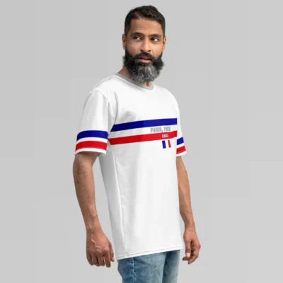 A male model, looking to the right, showcasing the white Paris France Luxurious Tee from BigBabyGorillaBear.Com. The shirt has he words "Paris, France" in grey font, between a blue and red band going across the chest of the shirt. A white "BBGB" is centered inside the red band, and beneath that is the France flag. The sleeves have a red and blue stripe. The collar is light grey.